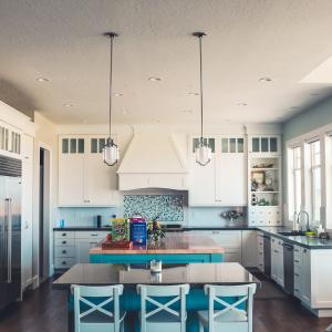 Kitchen with tile backsplash and wood-look laminate floor