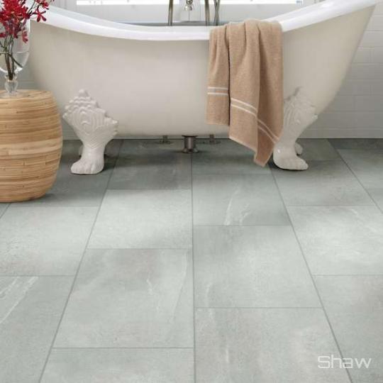 Bathroom scene with Sculpture porcelain tile by Shaw, in Grey