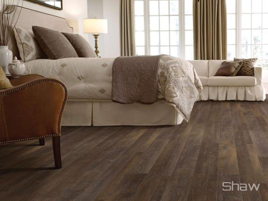 Room scene with Manor Ridge laminate flooring by Shaw, in Dark Canyon
