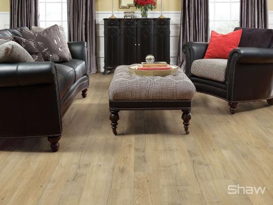 Room scene with Castle Ridge laminate flooring by Shaw, in Forge